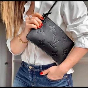 SOLD neverfull wristlet empreinte turtledove